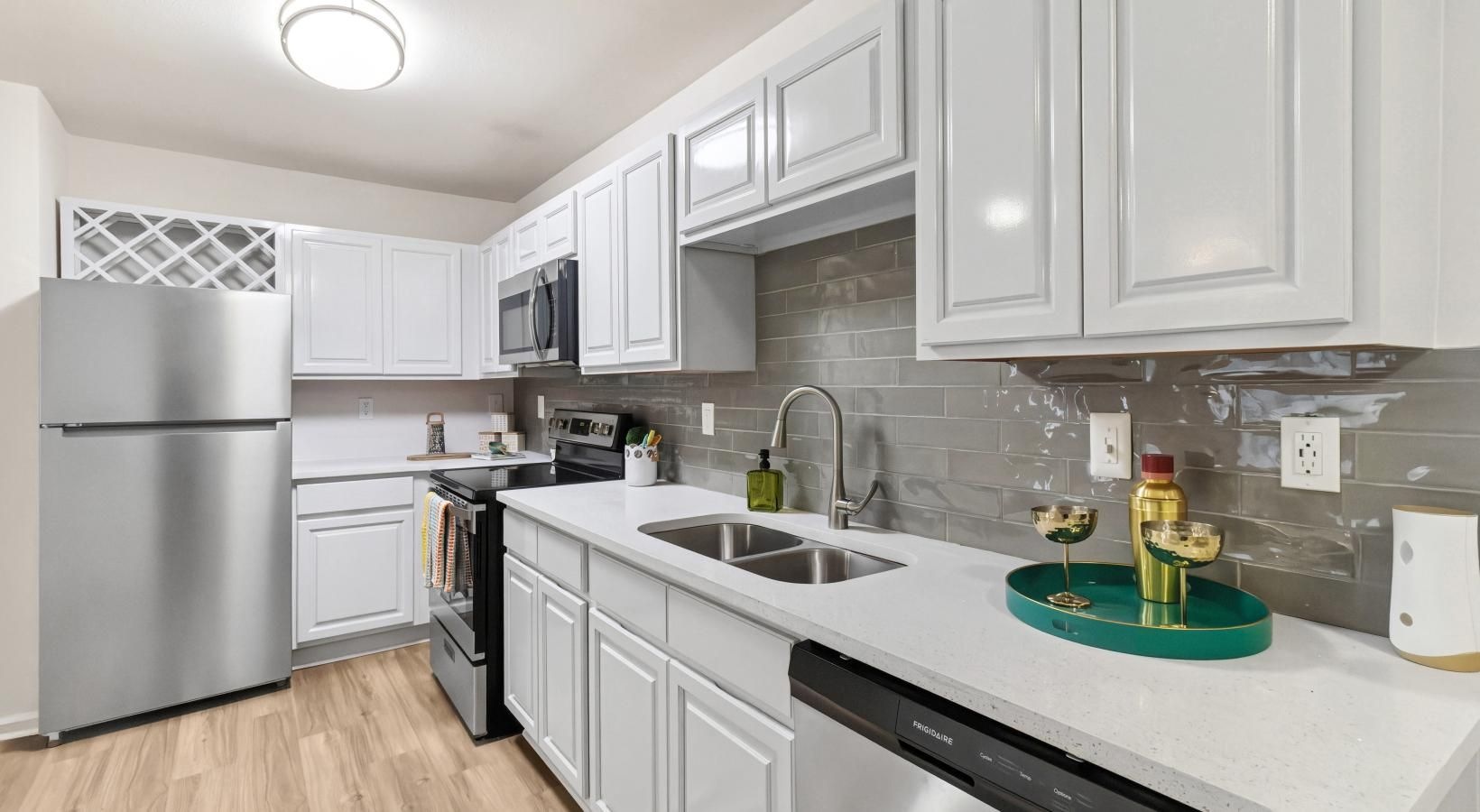 a kitchen with white cabinets